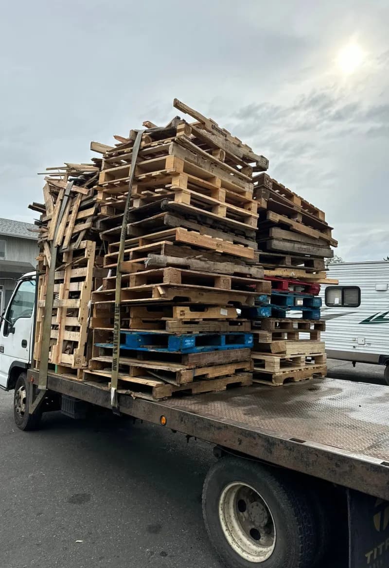 Pallets stacked high on a flatbed truck for delivery
