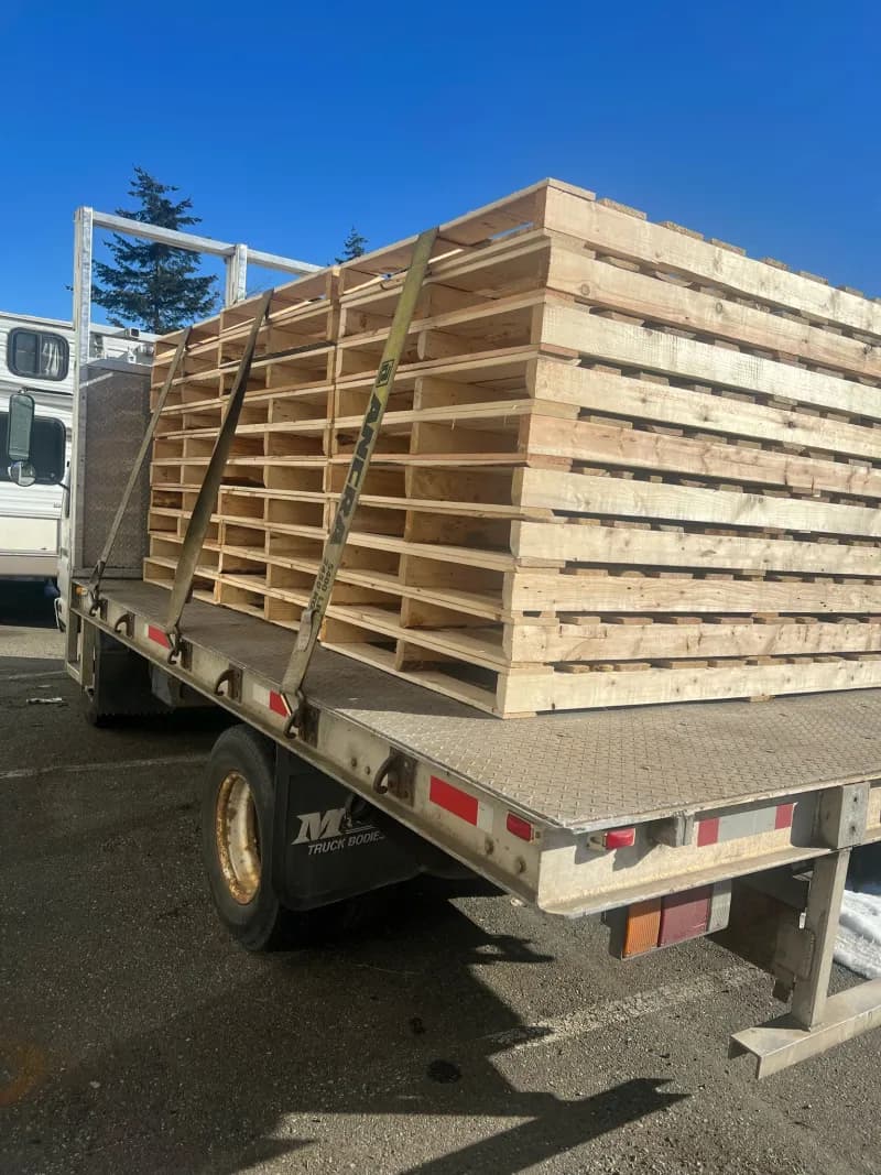 Flatbed truck loaded with pallets for delivery